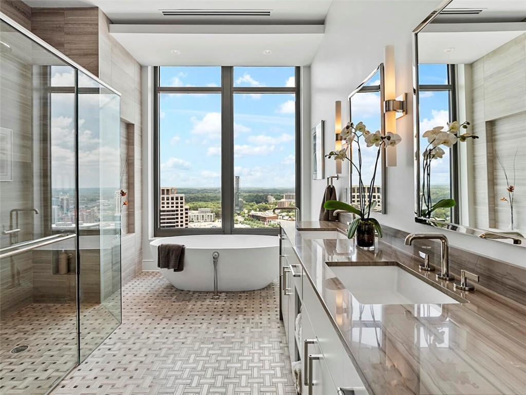 3376 Peachtree Road Northeast, Unit 44B Atlanta, GA 30326 - Photo 25 of 58 a room with a large window and a table chair