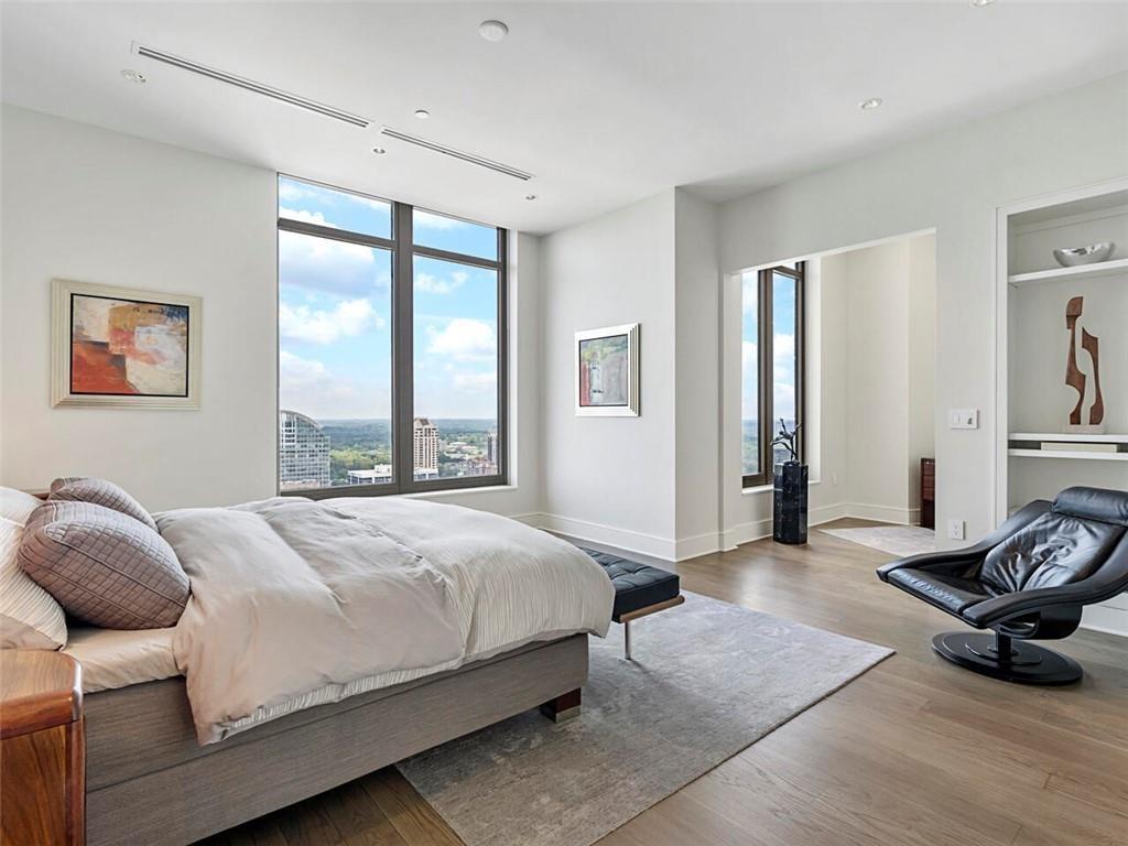 3376 Peachtree Road Northeast, Unit 44B Atlanta, GA 30326 - Photo 27 of 58 a bedroom with a bed and a window