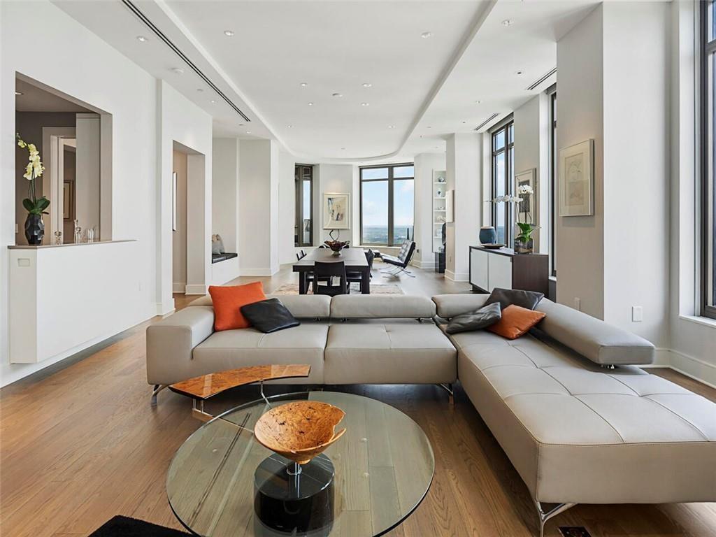3376 Peachtree Road Northeast, Unit 44B Atlanta, GA 30326 - Photo 3 of 58 a living room with furniture and wooden floor