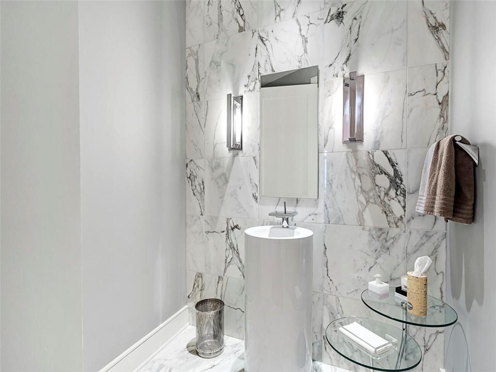 3376 Peachtree Road Northeast, Unit 44B Atlanta, GA 30326 - Photo 31 of 58 a bathroom with a sink and a mirror