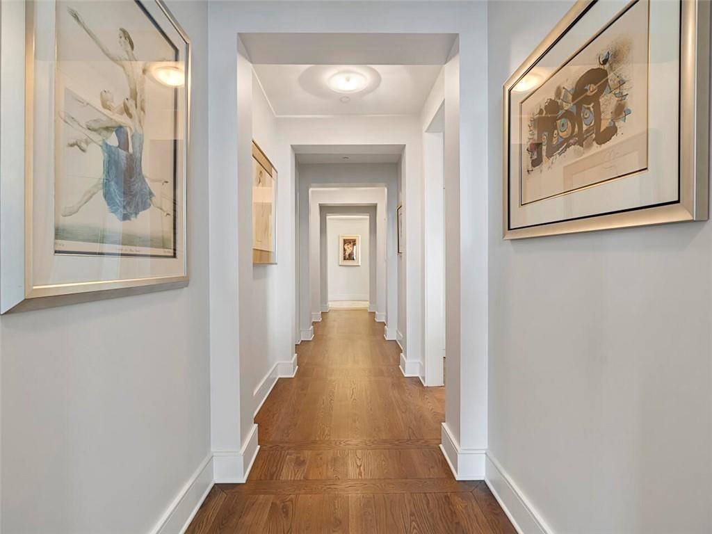 3376 Peachtree Road Northeast, Unit 44B Atlanta, GA 30326 - Photo 32 of 58 a view of a hallway with wooden floor