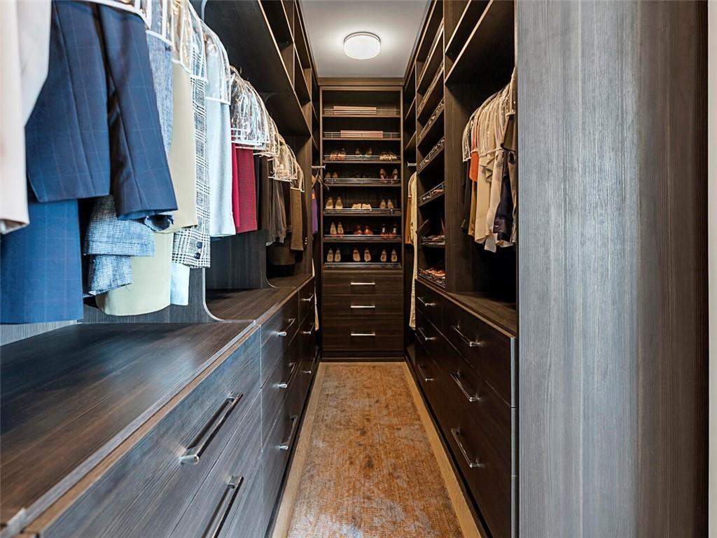 3376 Peachtree Road Northeast, Unit 44B Atlanta, GA 30326 - Photo 36 of 58 a kitchen with stainless steel appliances granite countertop a refrigerator and a stove