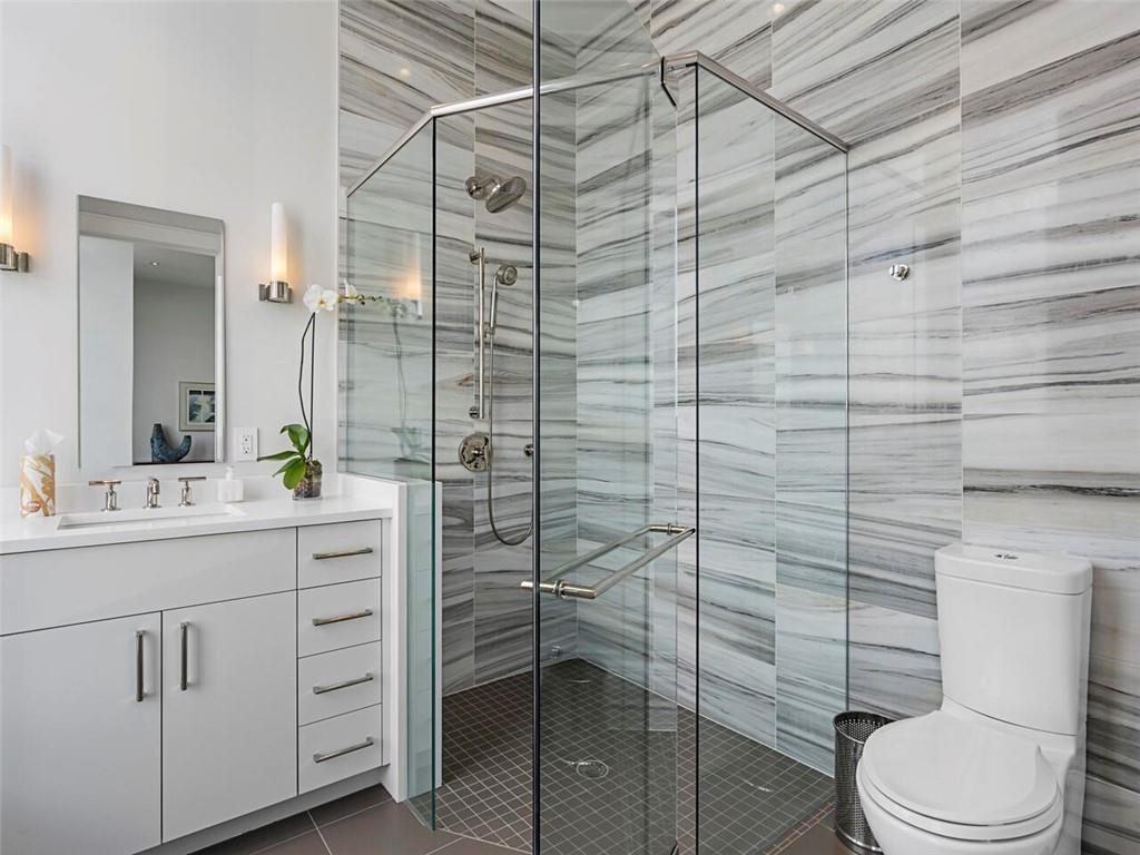 3376 Peachtree Road Northeast, Unit 44B Atlanta, GA 30326 - Photo 39 of 58 a bathroom with a toilet sink and shower