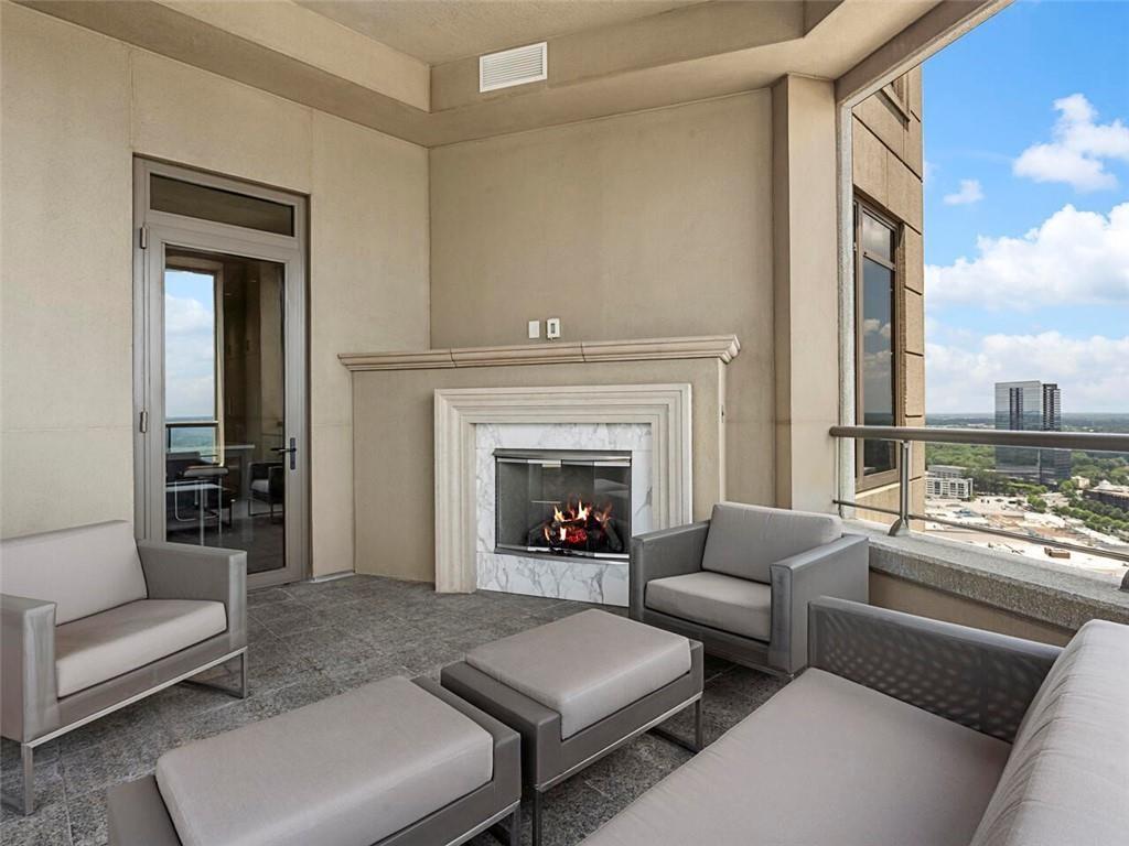 3376 Peachtree Road Northeast, Unit 44B Atlanta, GA 30326 - Photo 43 of 58 a living room with furniture and a fireplace