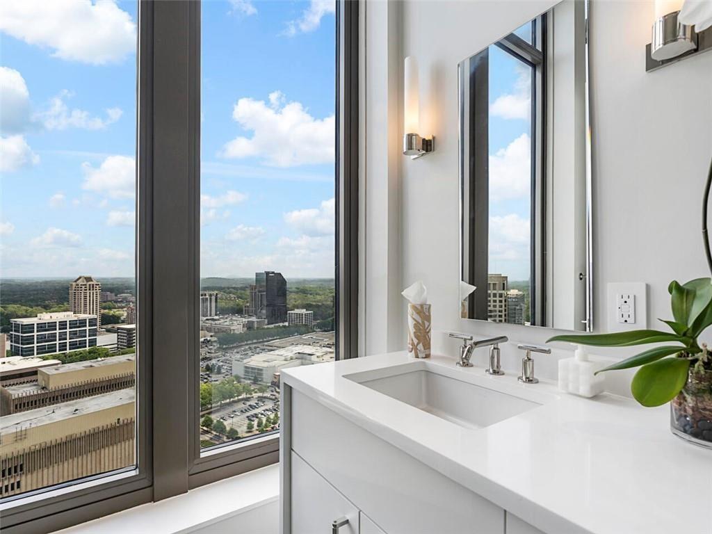 3376 Peachtree Road Northeast, Unit 44B Atlanta, GA 30326 - Photo 45 of 58 a bathroom with a sink and a mirror