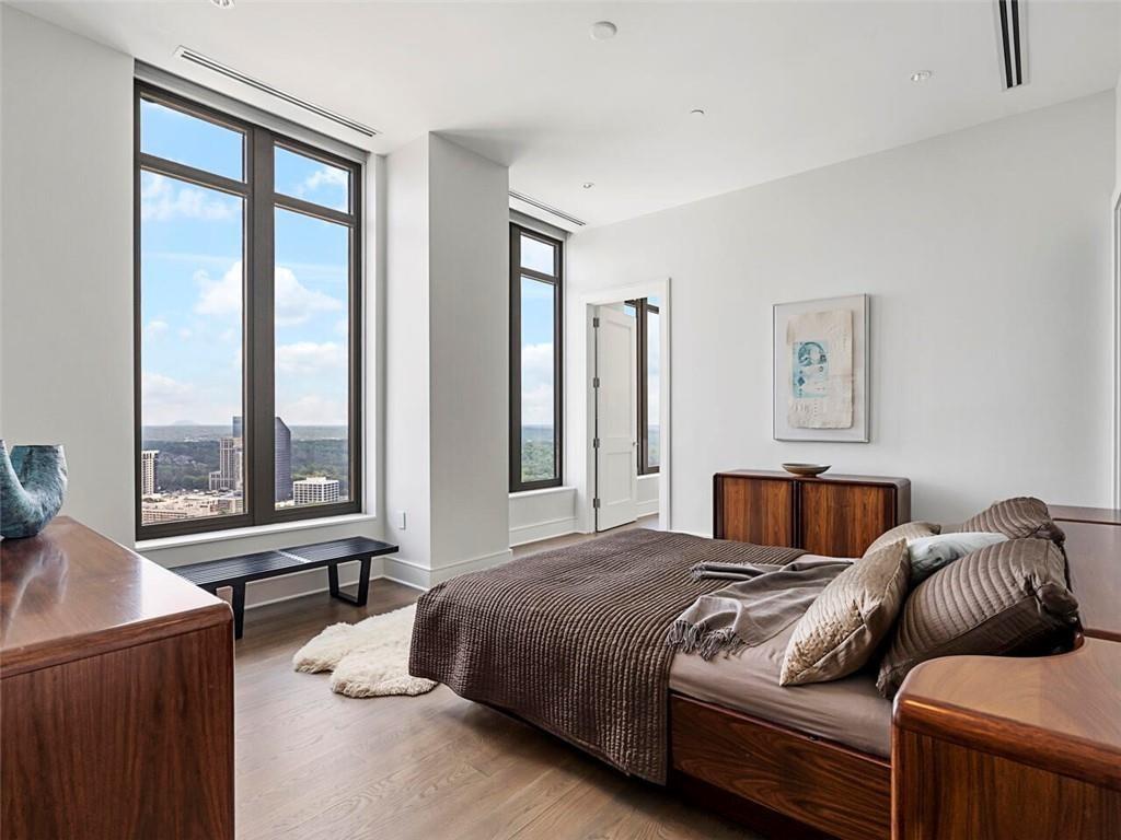 3376 Peachtree Road Northeast, Unit 44B Atlanta, GA 30326 - Photo 48 of 58 a bedroom with furniture and a large window