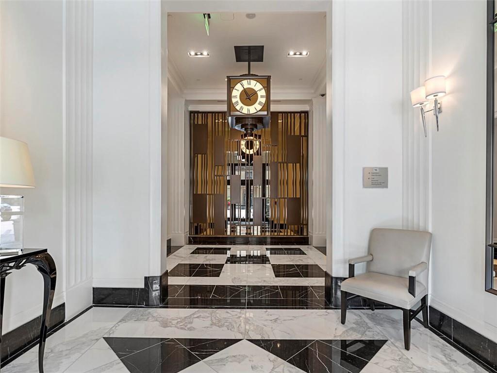3376 Peachtree Road Northeast, Unit 44B Atlanta, GA 30326 - Photo 49 of 58 a view of a hallway with furniture and a table