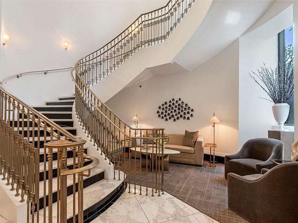 3376 Peachtree Road Northeast, Unit 44B Atlanta, GA 30326 - Photo 50 of 58 a living room with furniture and wooden floor