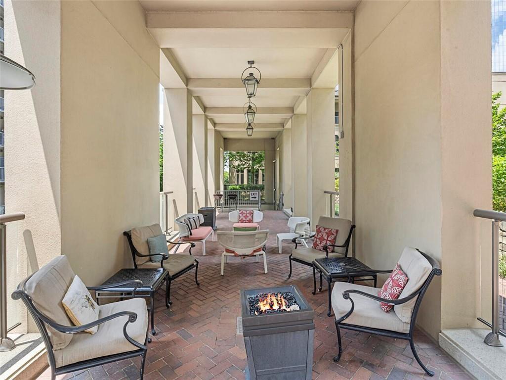3376 Peachtree Road Northeast, Unit 44B Atlanta, GA 30326 - Photo 52 of 58 a living room with furniture and wooden floor