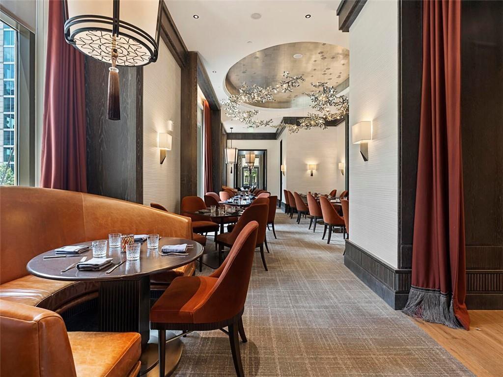 3376 Peachtree Road Northeast, Unit 44B Atlanta, GA 30326 - Photo 56 of 58 a view of a dining room with furniture and chandelier
