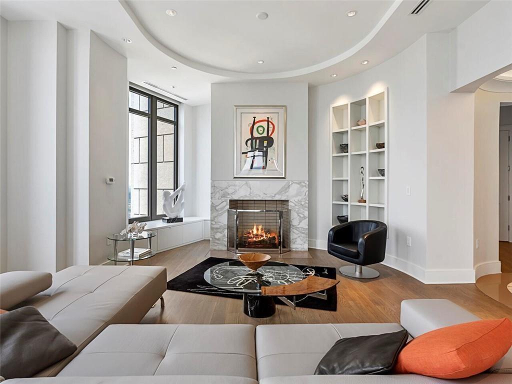 3376 Peachtree Road Northeast, Unit 44B Atlanta, GA 30326 - Photo 6 of 58 a living room with furniture and a fireplace