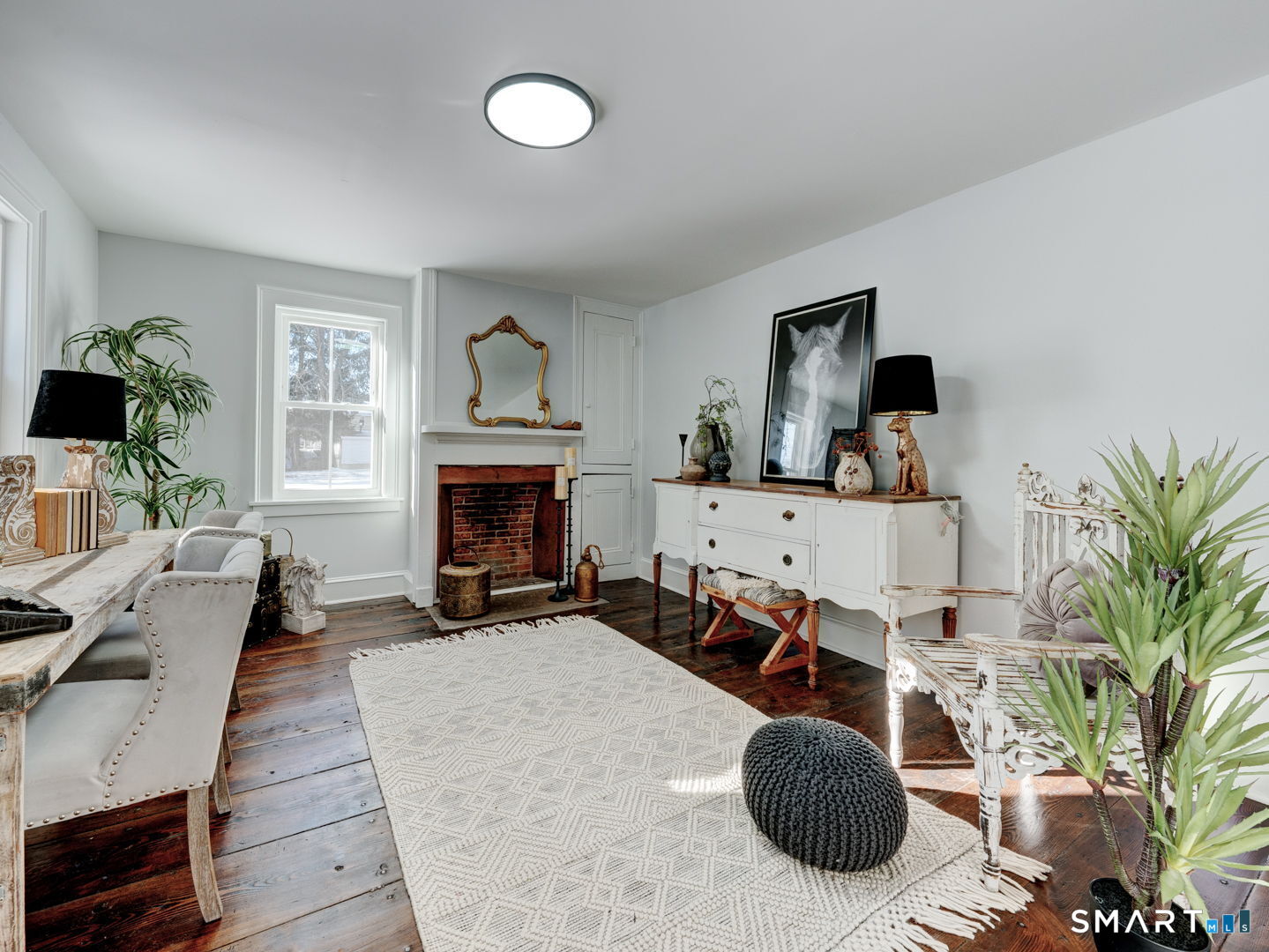 76 Griffin Road East Windsor, CT 06016 - Photo 15 of 35 a living room with furniture a fireplace and potted plants