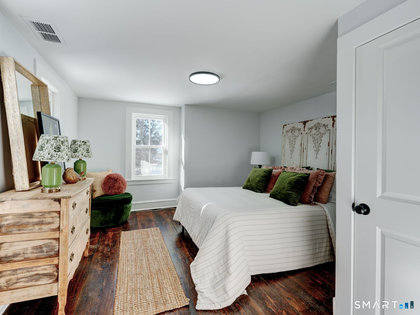 76 Griffin Road East Windsor, CT 06016 - Photo 22 of 35 a bedroom with a bed and wooden floor