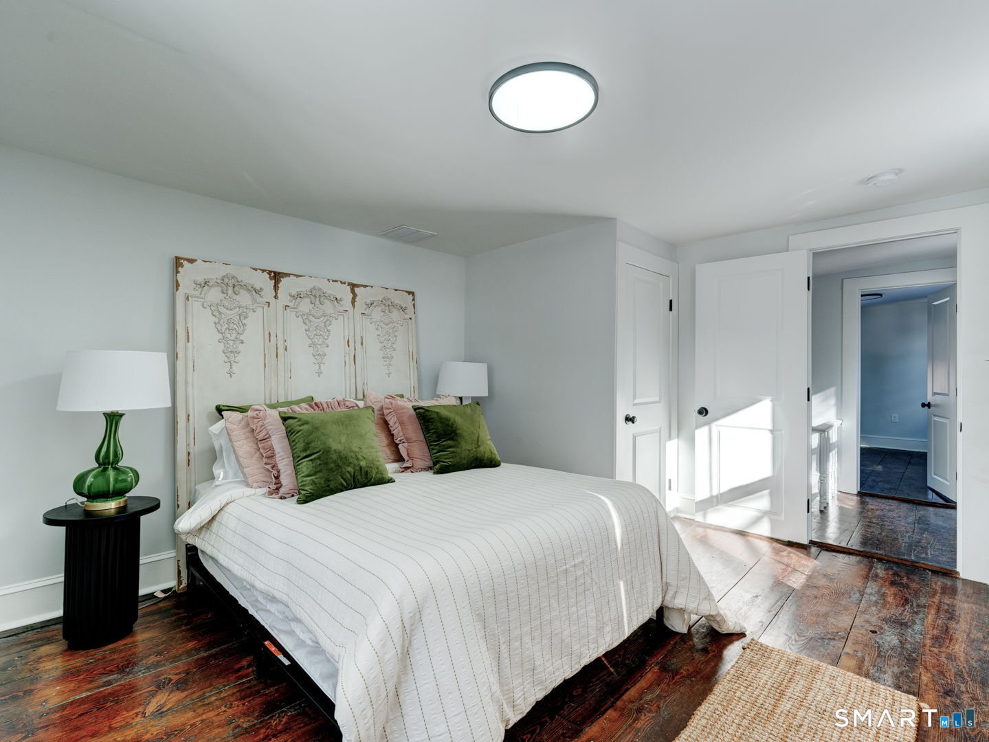 76 Griffin Road East Windsor, CT 06016 - Photo 24 of 35 a bedroom with a bed and a potted plant