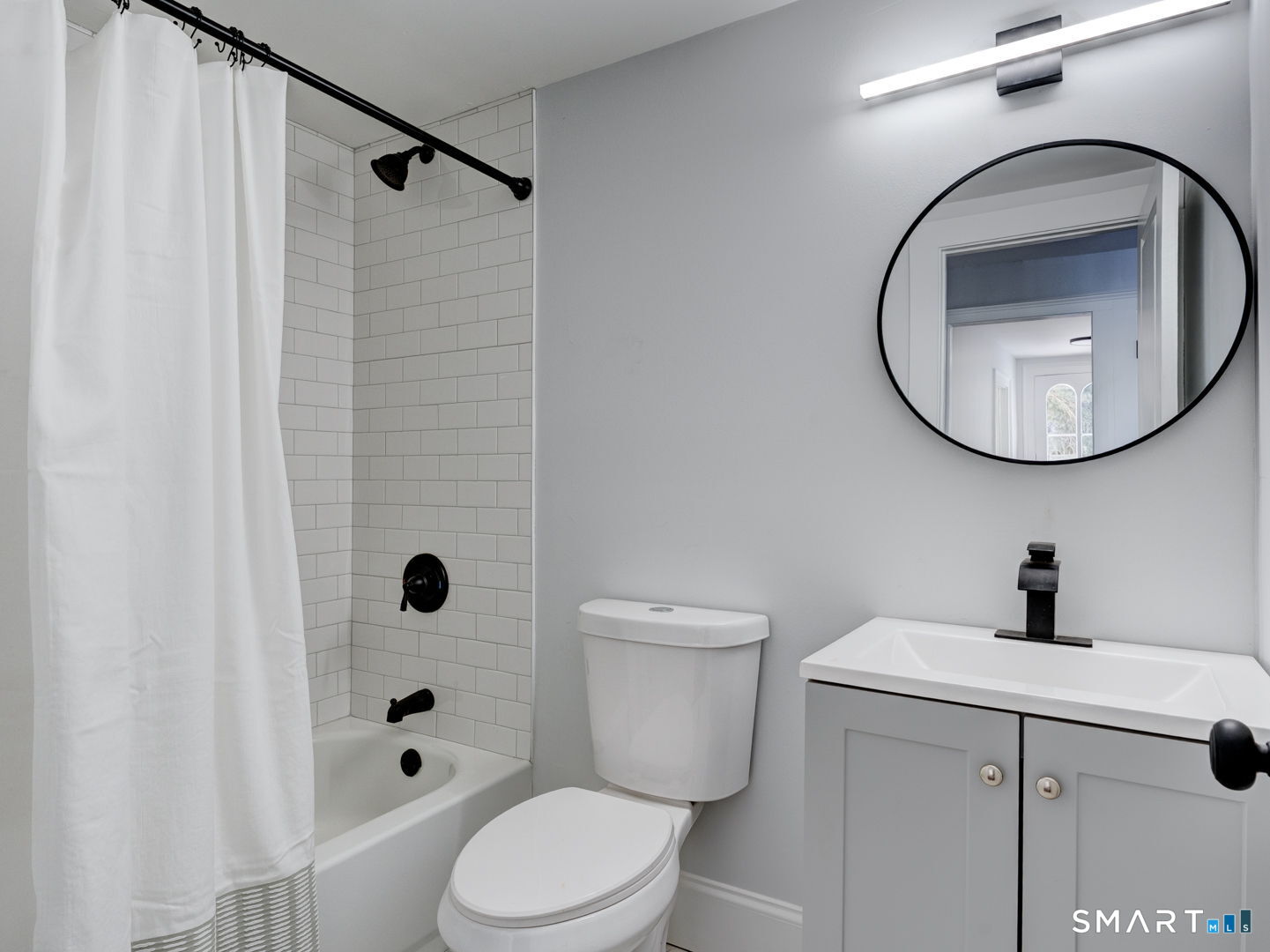 76 Griffin Road East Windsor, CT 06016 - Photo 26 of 35 a bathroom with a toilet a sink and a mirror
