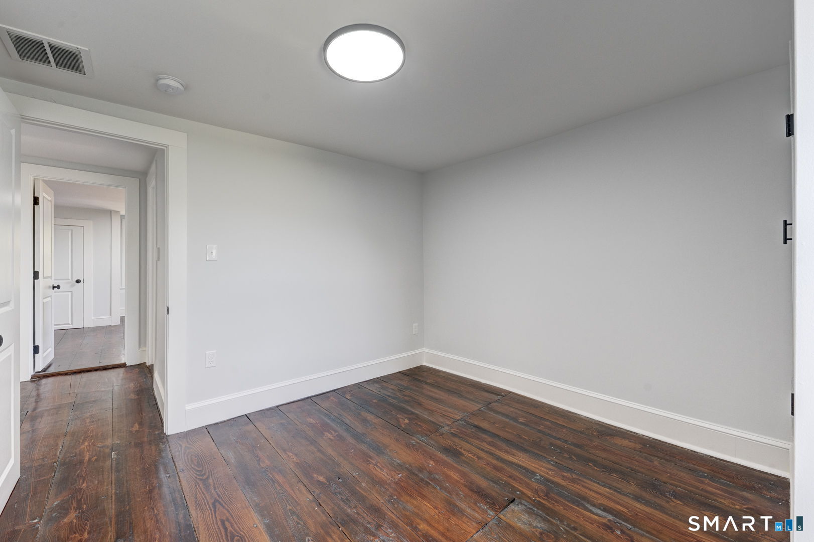 76 Griffin Road East Windsor, CT 06016 - Photo 28 of 35 a view of a room with wooden floor and white walls