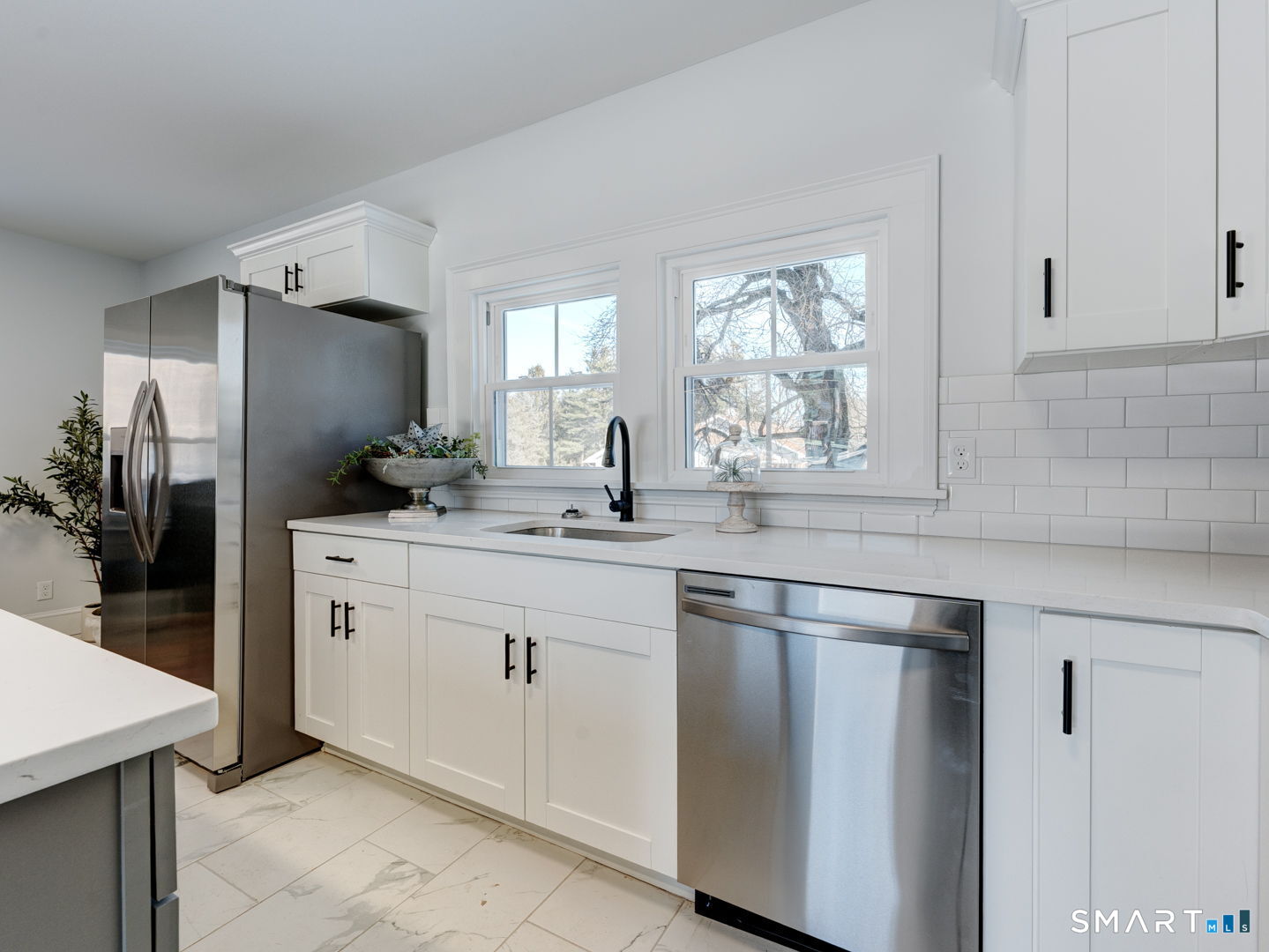 76 Griffin Road East Windsor, CT 06016 - Photo 10 of 35 a kitchen with white cabinets and a sink