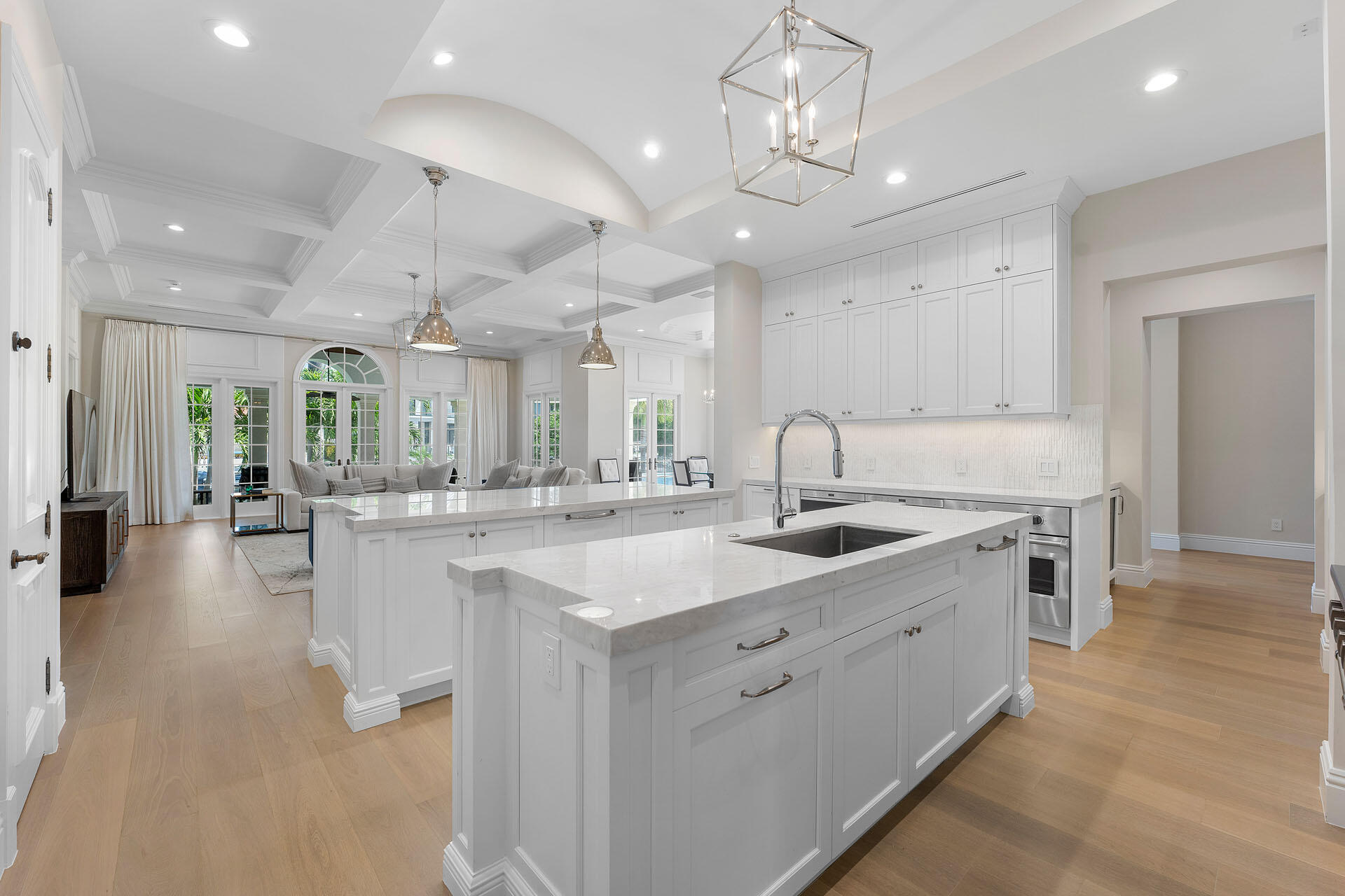 251 Coconut Palm Road Boca Raton, FL 33432 - Photo 20 of 97 a large white kitchen with a large island oven a sink stainless steel appliances and cabinets