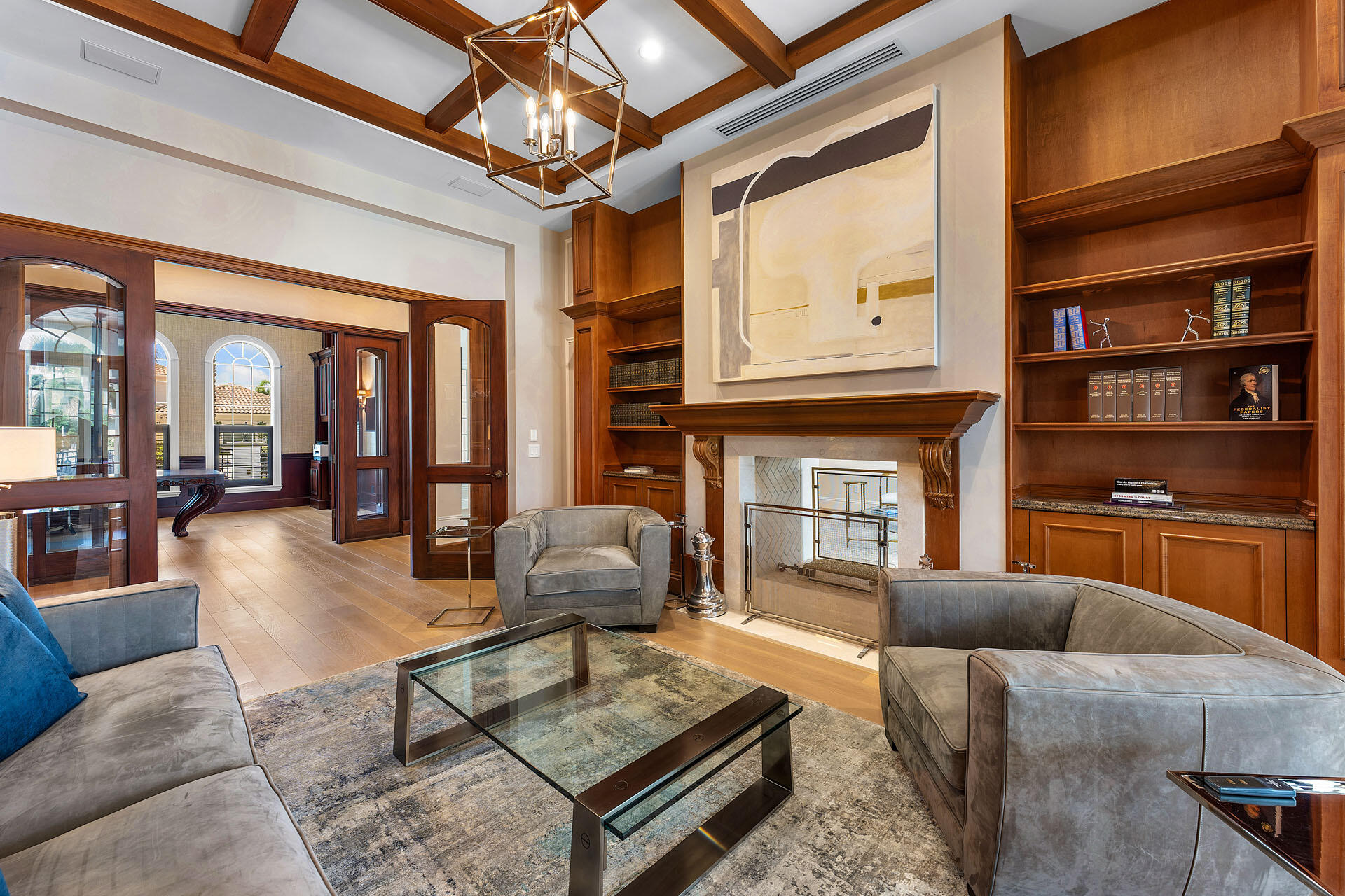 251 Coconut Palm Road Boca Raton, FL 33432 - Photo 40 of 97 a living room with fireplace furniture and a book shelf