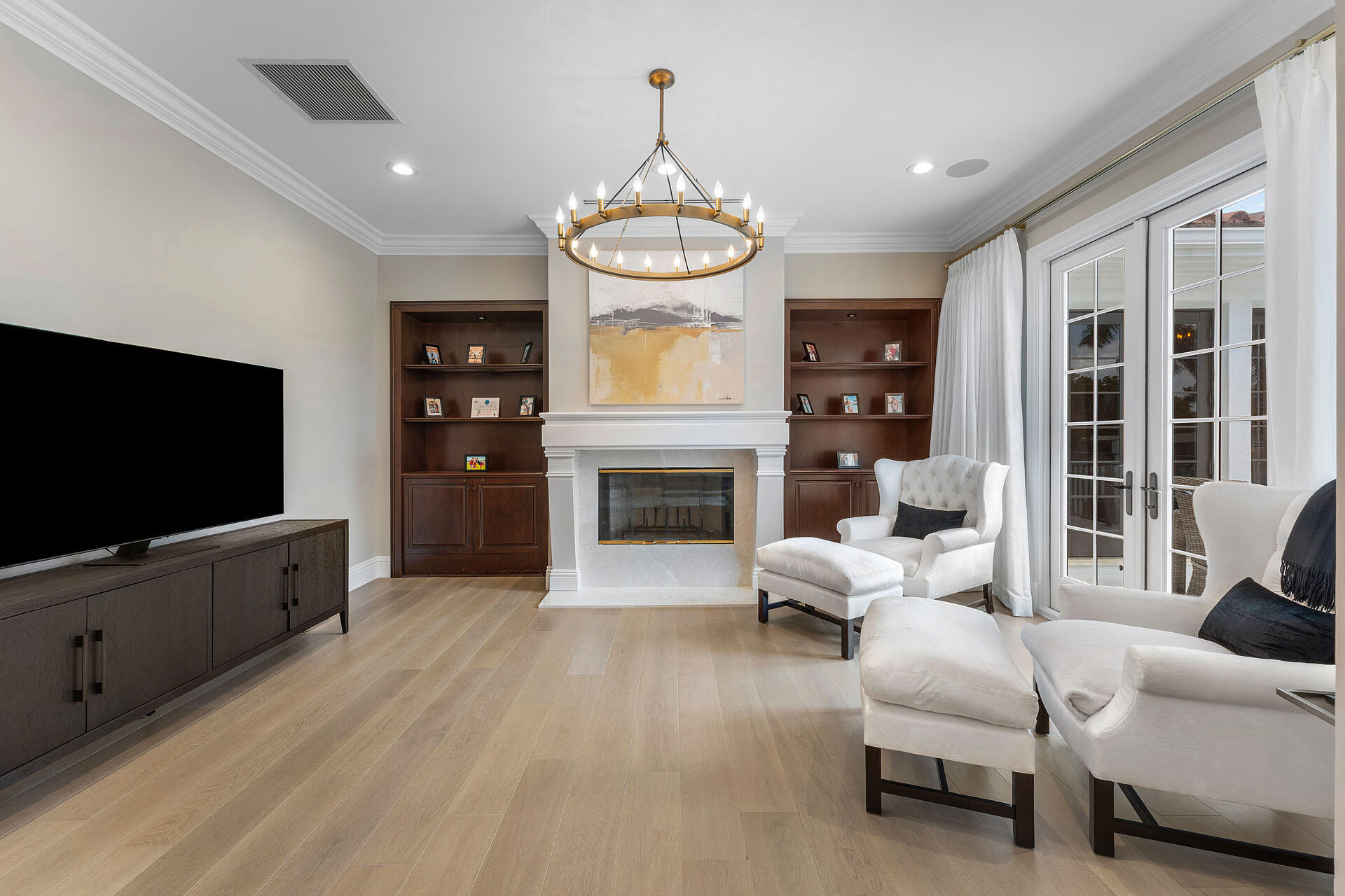 251 Coconut Palm Road Boca Raton, FL 33432 - Photo 53 of 97 a living room with furniture a fireplace and a flat screen tv