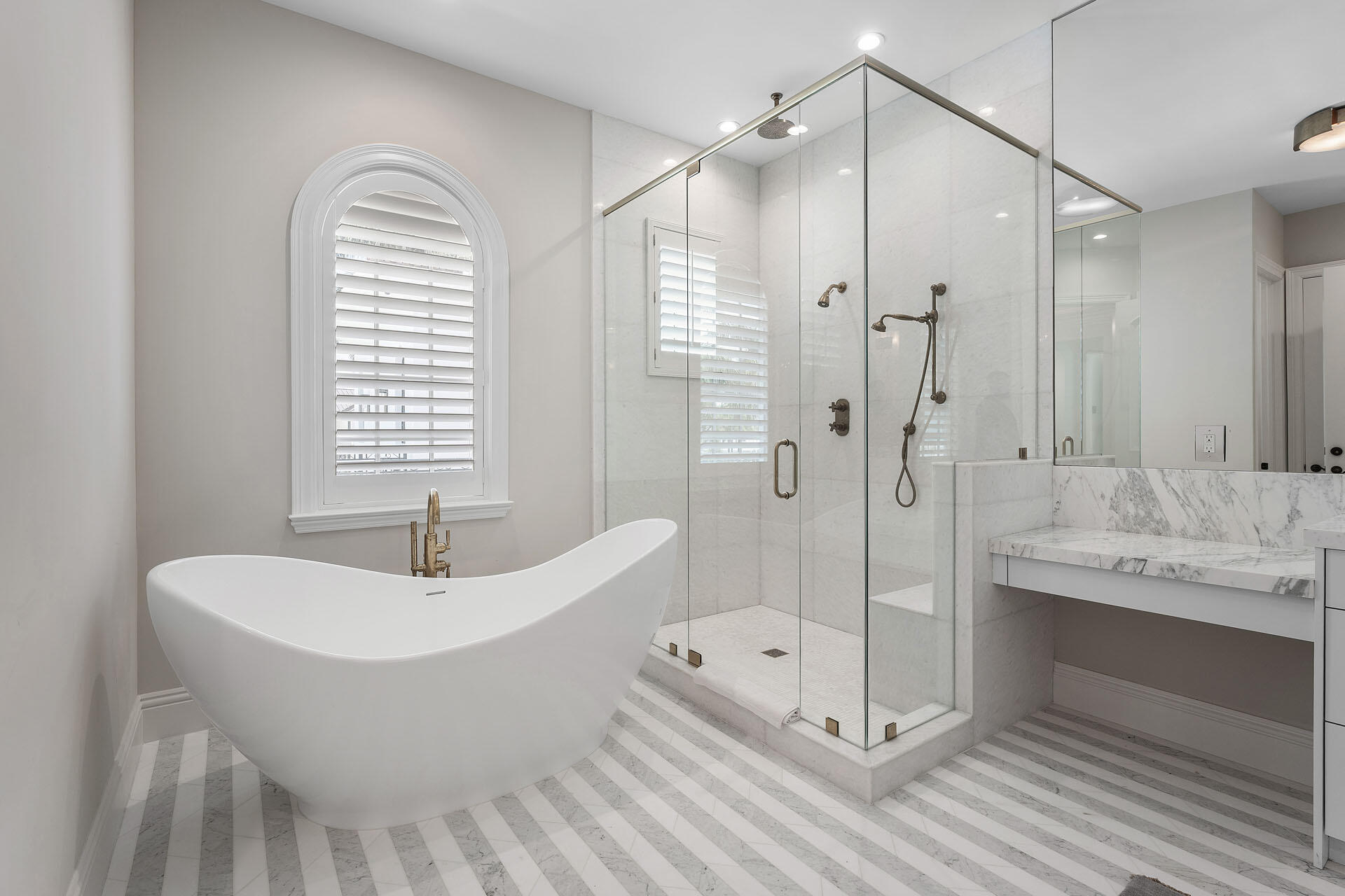 251 Coconut Palm Road Boca Raton, FL 33432 - Photo 57 of 97 a bathroom with a white tub shower vanity and a sink