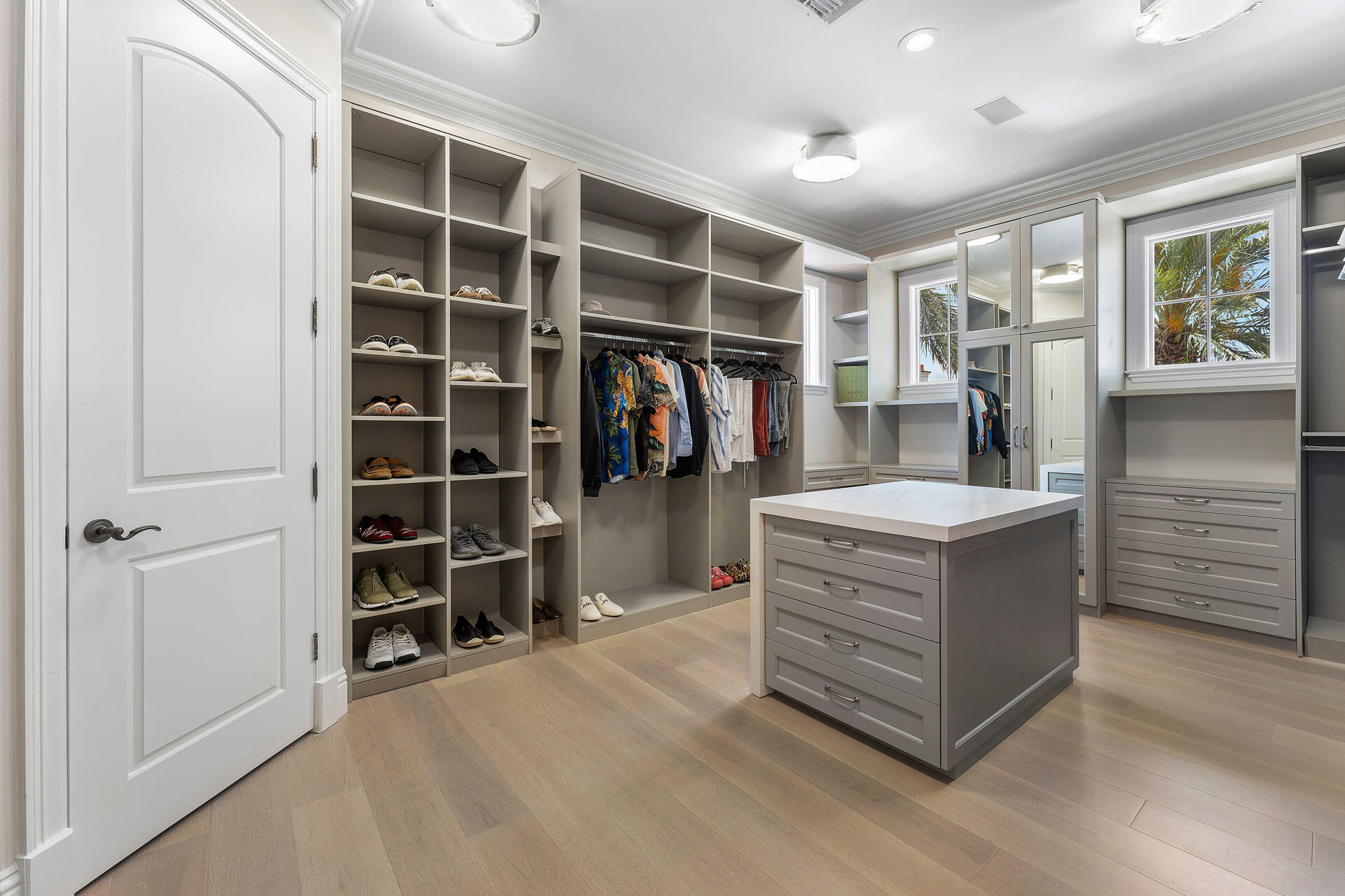 251 Coconut Palm Road Boca Raton, FL 33432 - Photo 59 of 97 a view of walk in closet with clothes and shoes