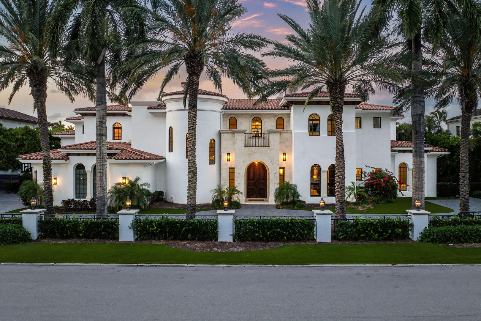 251 Coconut Palm Road Boca Raton, FL 33432 - Photo 84 of 97 front view of house with a yard and palm trees
