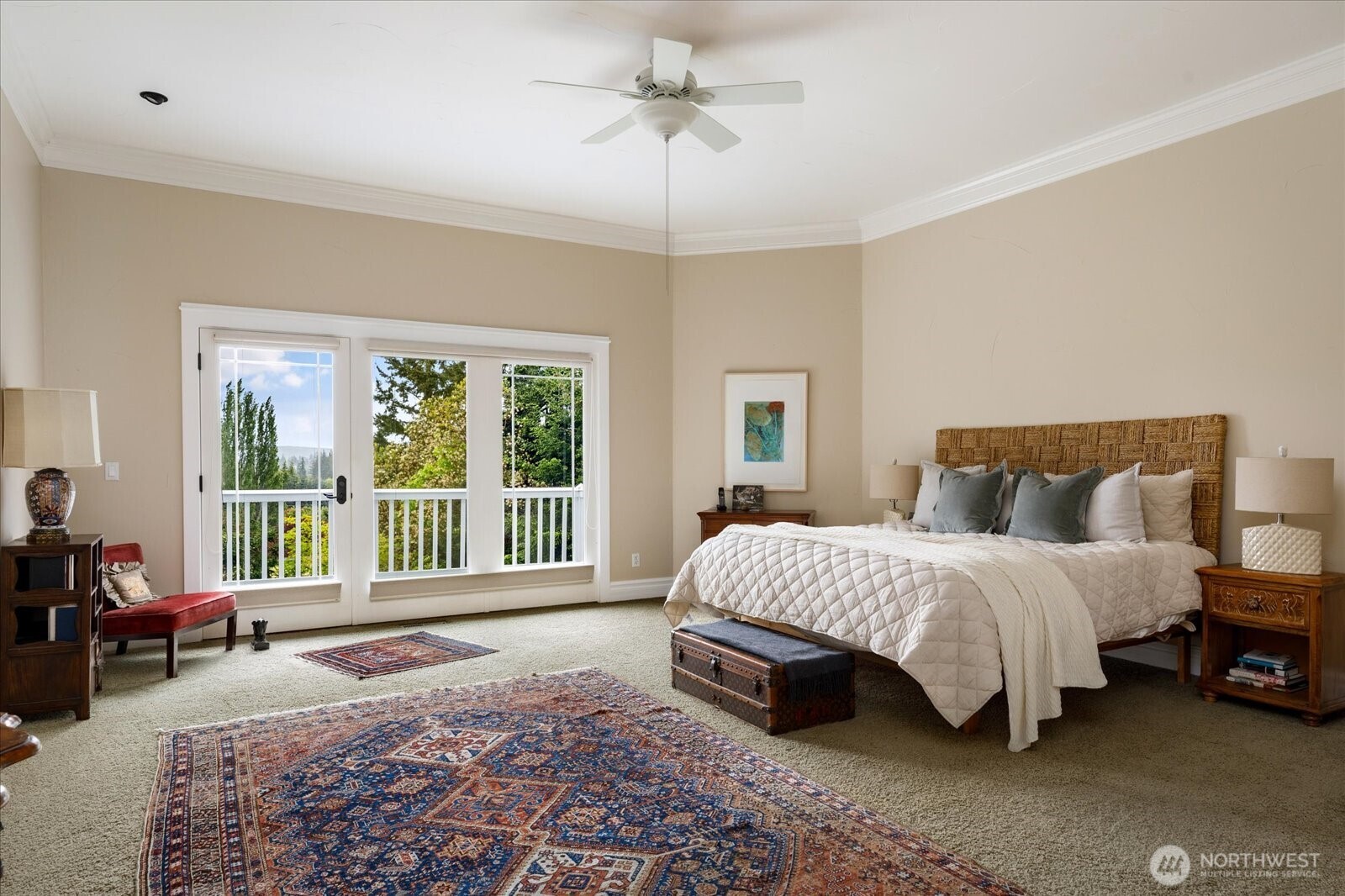 5427 Bayview Road Langley, WA 98260 - Photo 16 of 40 a spacious bedroom with a bed and a large window