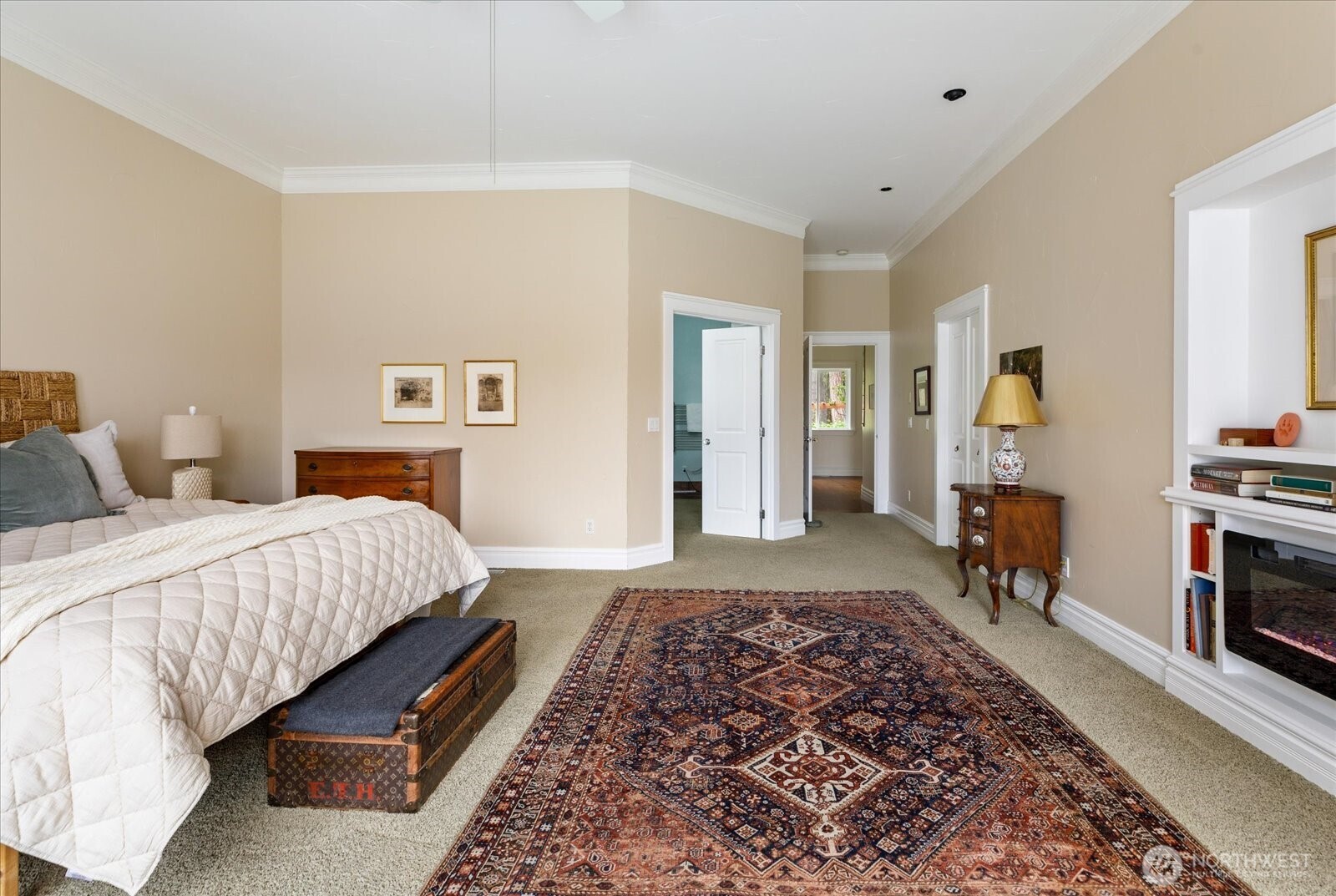 5427 Bayview Road Langley, WA 98260 - Photo 18 of 40 a bedroom with a large bed and a couch