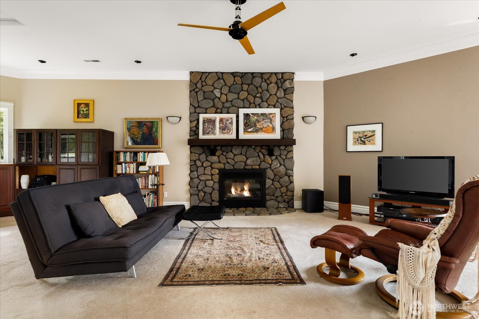 5427 Bayview Road Langley, WA 98260 - Photo 22 of 40 a living room with furniture and a fireplace