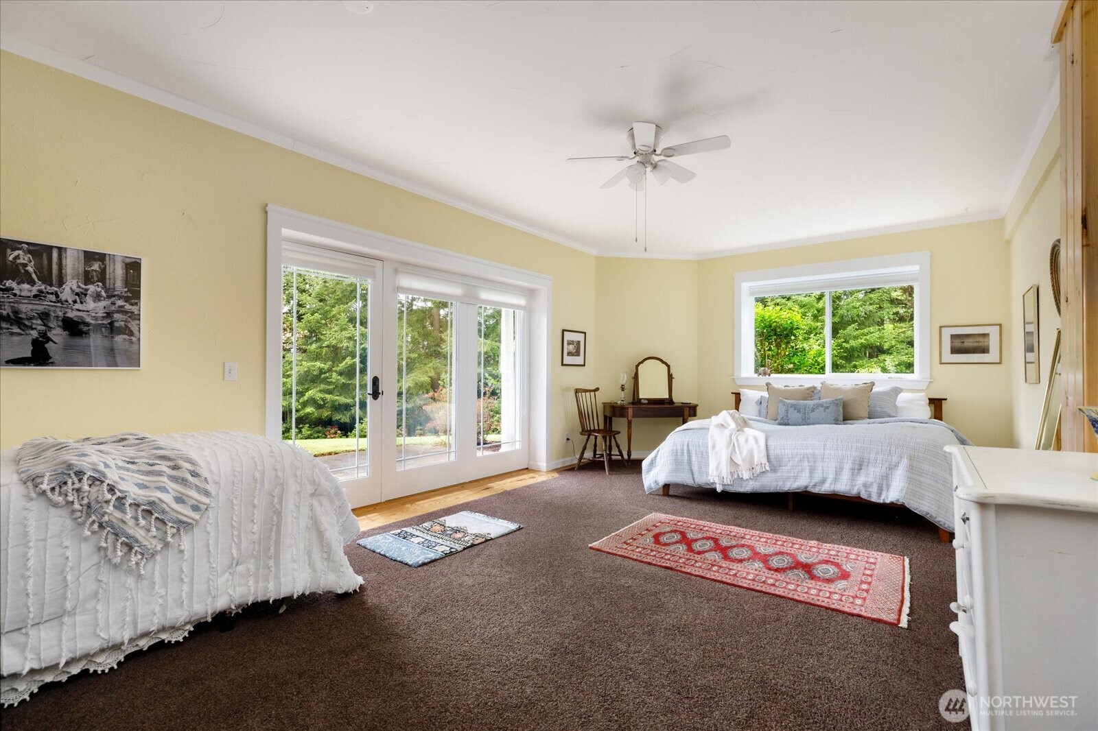 5427 Bayview Road Langley, WA 98260 - Photo 30 of 40 a living room with a bed furniture and a window