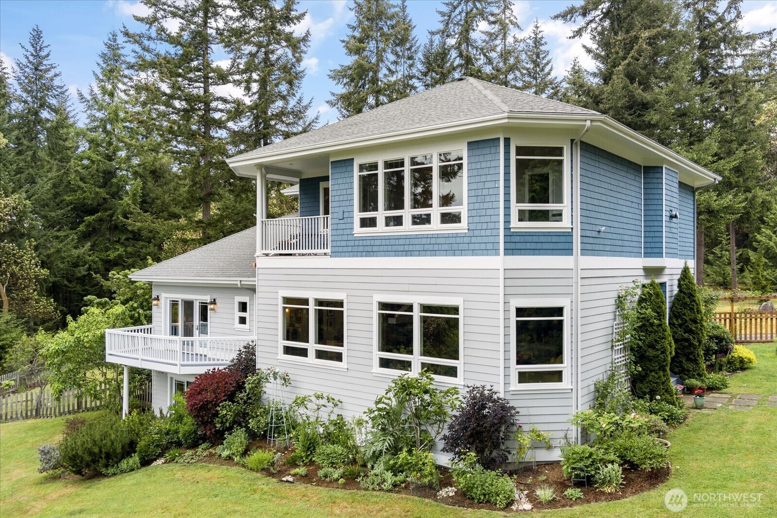 5427 Bayview Road Langley, WA 98260 - Photo 32 of 40 a front view of a house with garden
