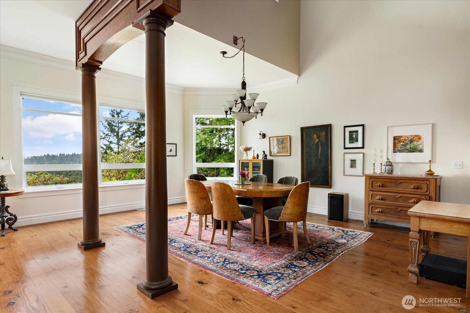 5427 Bayview Road Langley, WA 98260 - Photo 10 of 40 a dining room with furniture a rug a rug and a large window