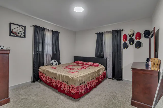 a bedroom with a bed and cabinets