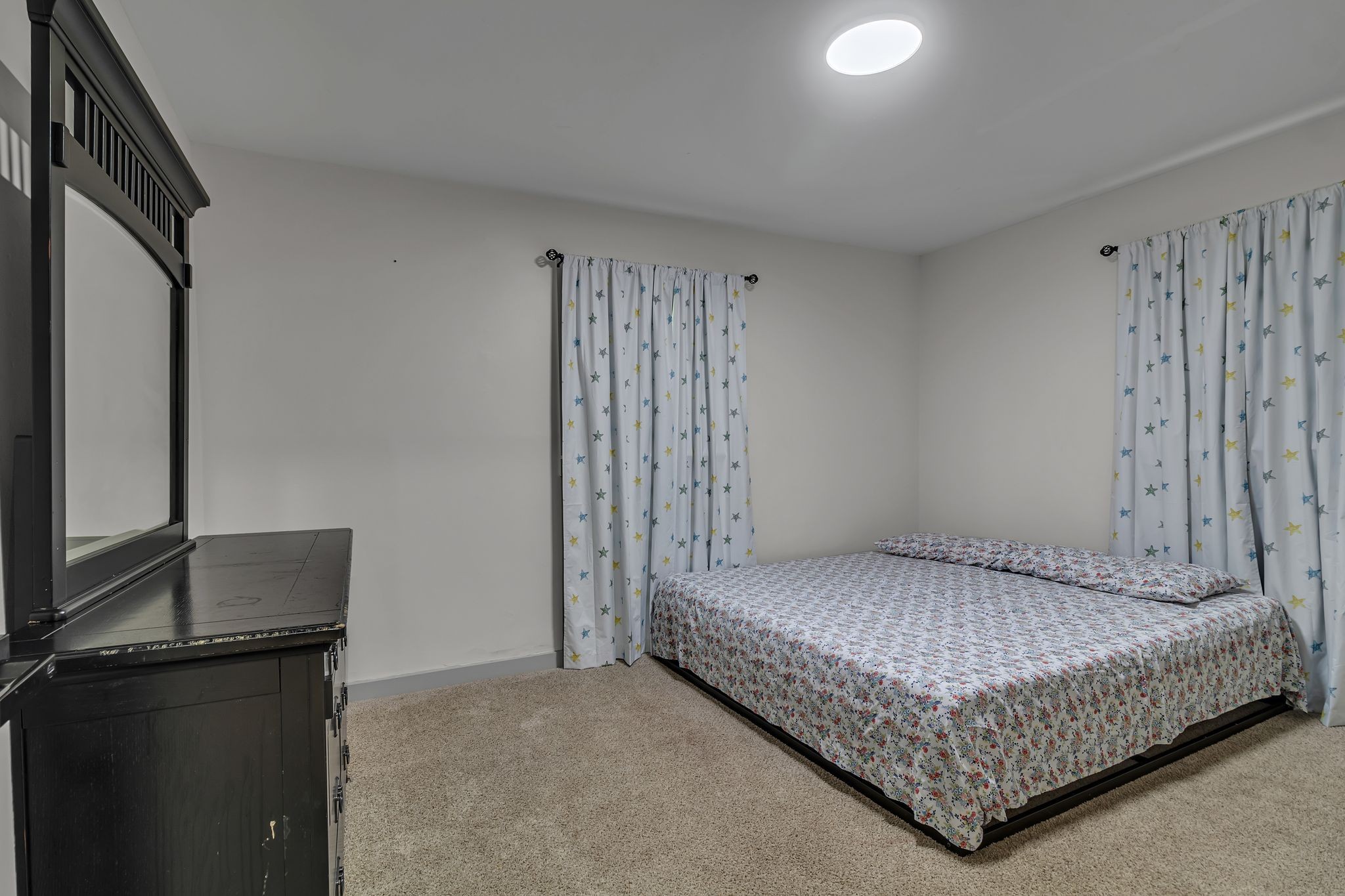 3759 Snell Road Murfreesboro, TN 37127 - Photo 21 of 27 a bedroom with a bed and a flat tv screen on the dresser