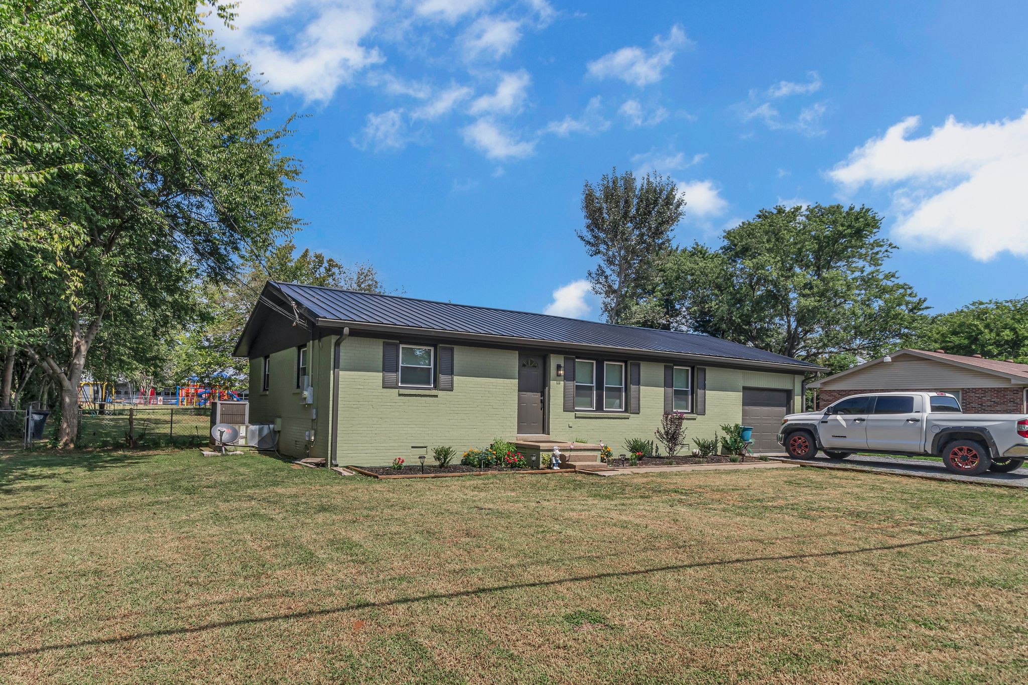 3759 Snell Road Murfreesboro, TN 37127 - Photo 5 of 27 a front view of a house with garden