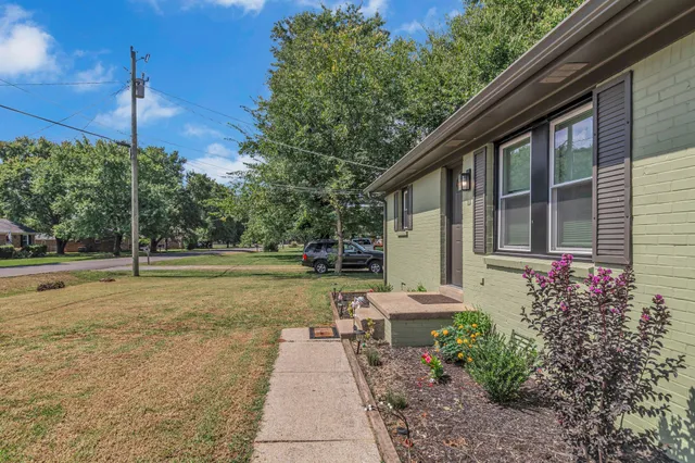 a house view with a sitting space and garden space