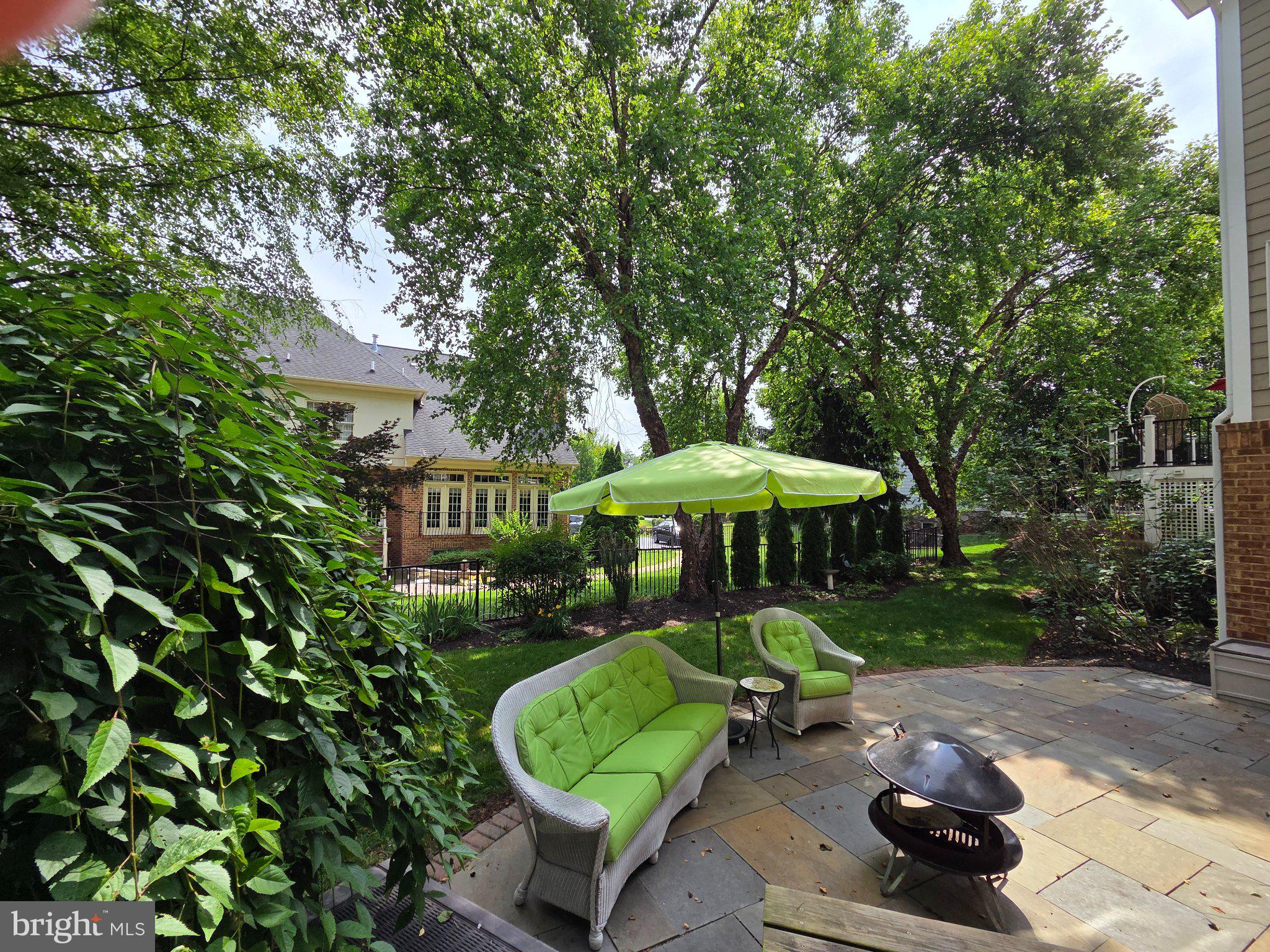 15006 Ransom Oaks Court Gainesville, VA 20155 - Photo 34 of 57 Lush garden retreat with vibrant seating.