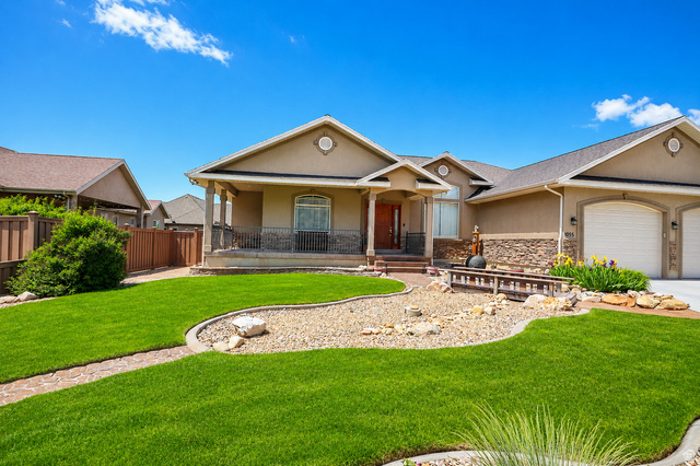 1055 North 1000 East Mapleton, UT 84664 - Photo 107 of 112 Stucco exterior with stone accents and a covered front porch featuring wrought iron railing