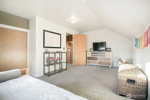 a bedroom with furniture and white walls