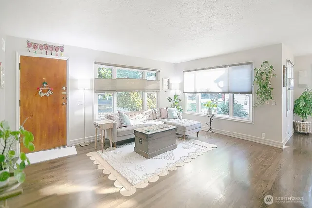 a living room with furniture and a large window