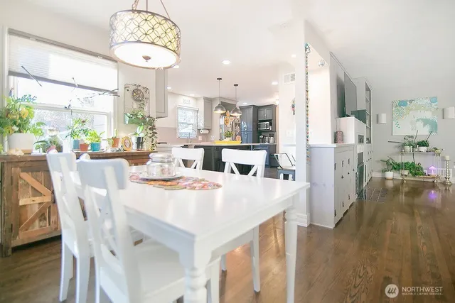 a large kitchen with a table and chairs