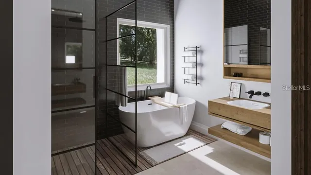 a bathroom with a tub and a sink