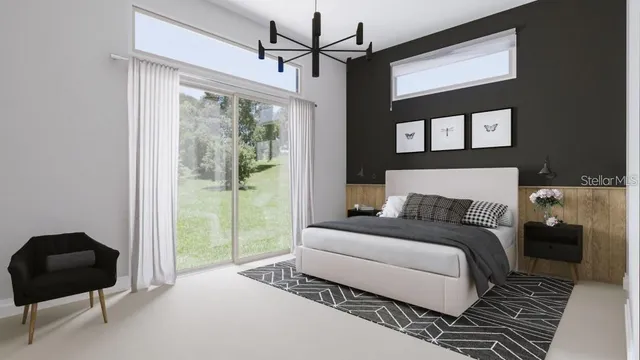 a bedroom with a bed and a chair