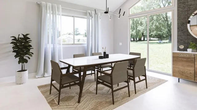 a dining room with furniture window and wooden floor