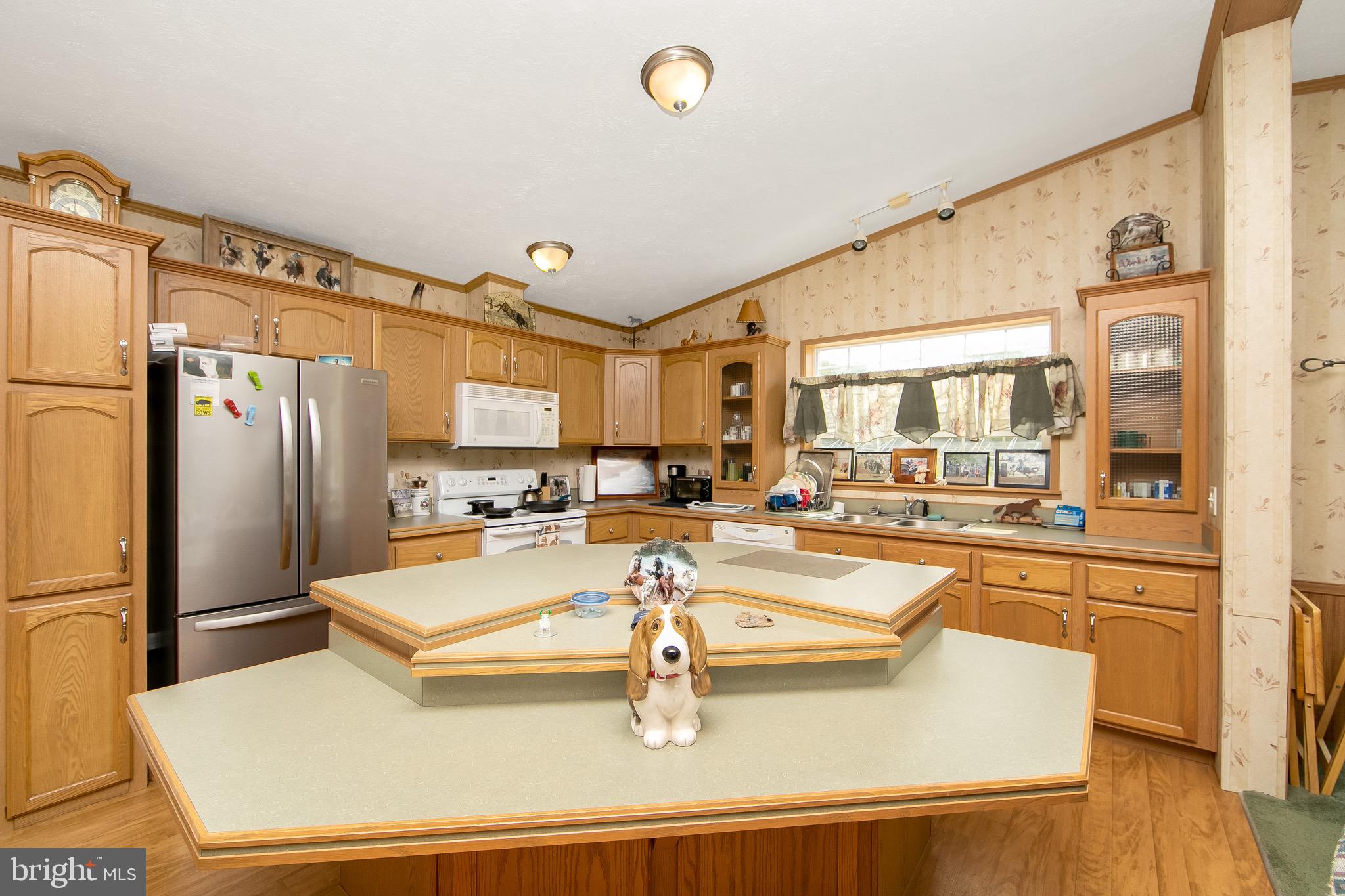 54 Three Bridge Road Monroeville, NJ 08343 - Photo 13 of 35 a kitchen with stainless steel appliances granite countertop a refrigerator a oven and white cabinets