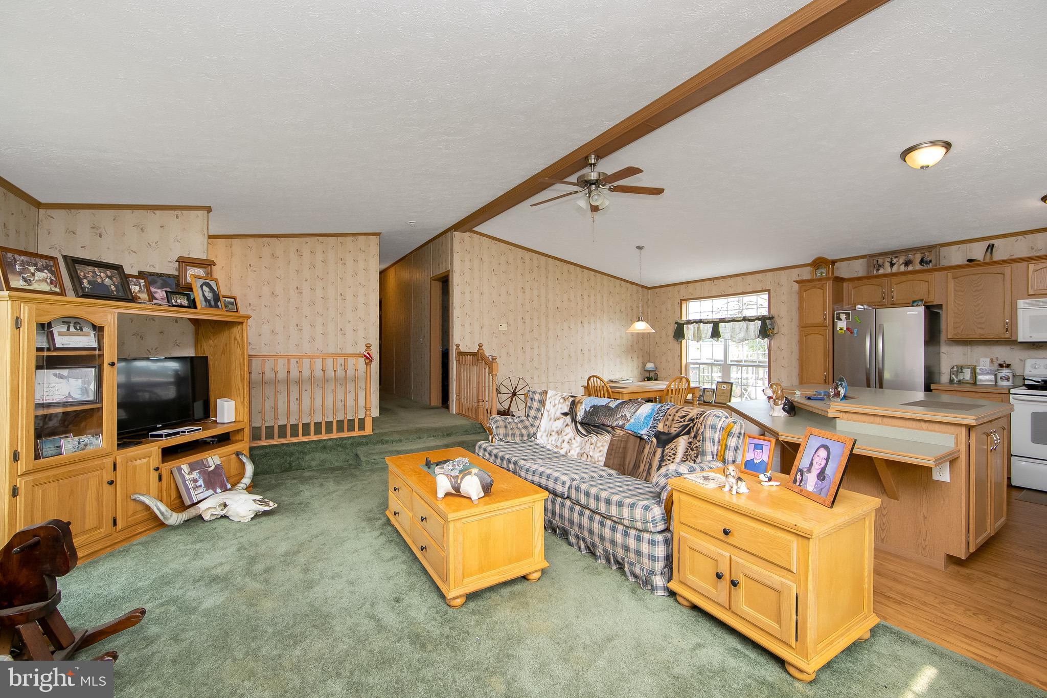 54 Three Bridge Road Monroeville, NJ 08343 - Photo 15 of 35 a living room with furniture and a flat screen tv