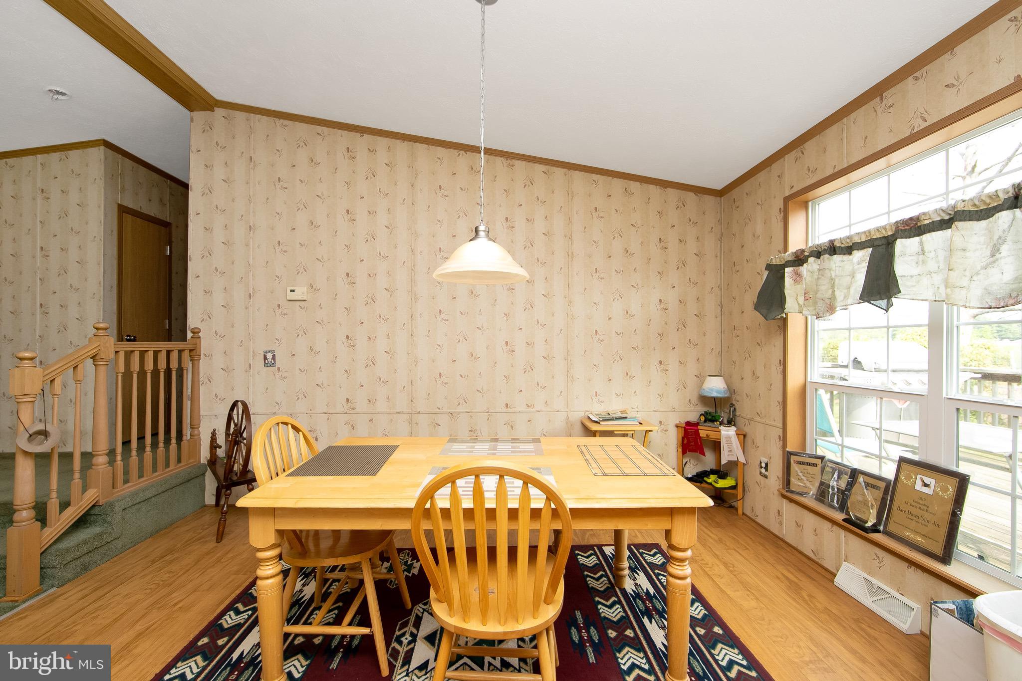 54 Three Bridge Road Monroeville, NJ 08343 - Photo 17 of 35 a view of a dining room with furniture window and wooden floor