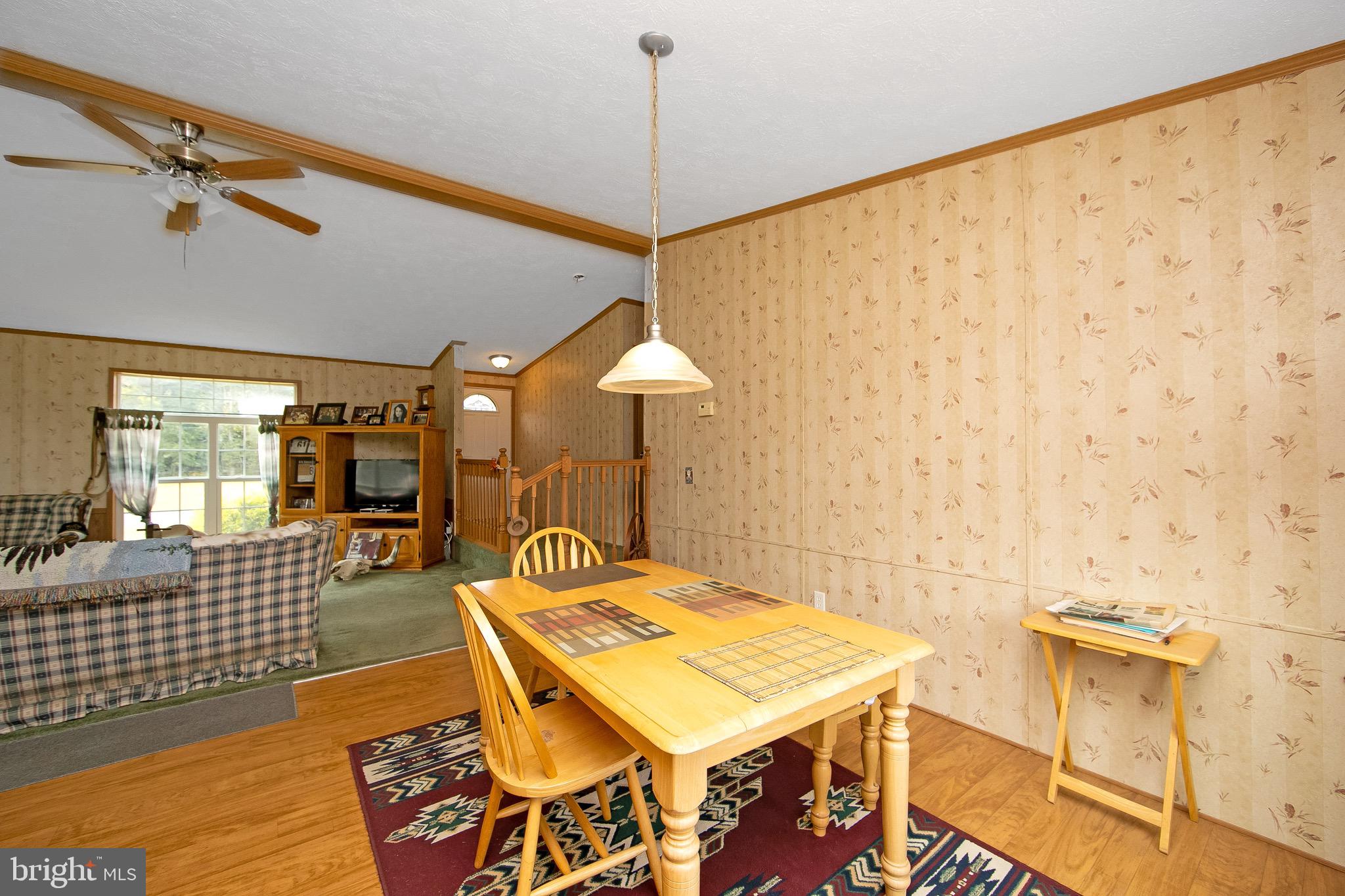 54 Three Bridge Road Monroeville, NJ 08343 - Photo 20 of 35 a living room with a table and chairs