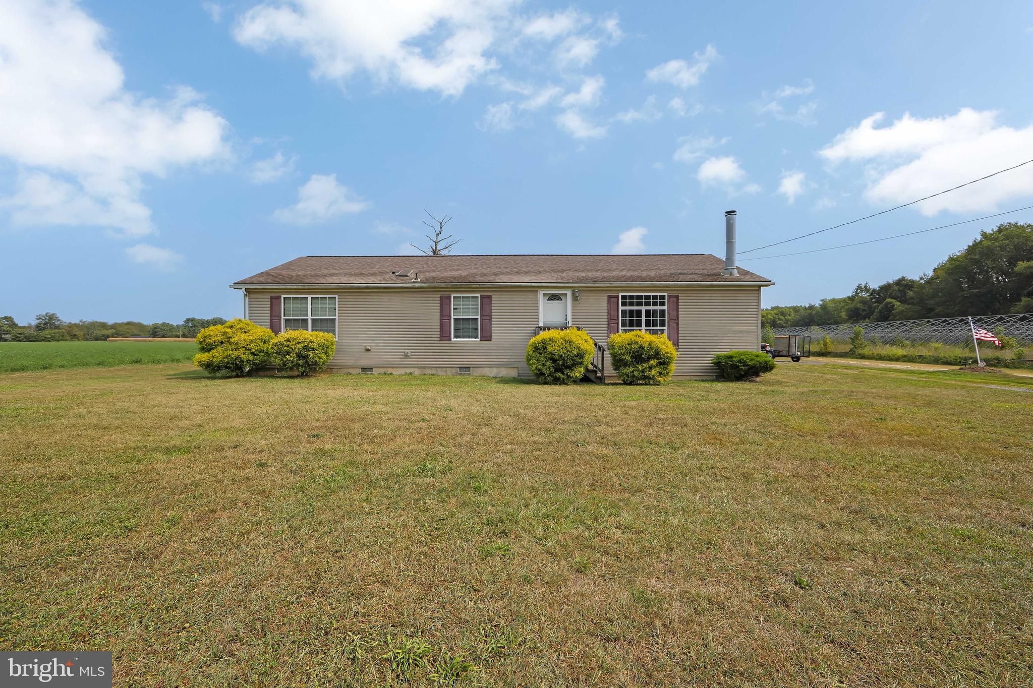 54 Three Bridge Road Monroeville, NJ 08343 - Photo 2 of 35 a view of a house with a yard and ocean view